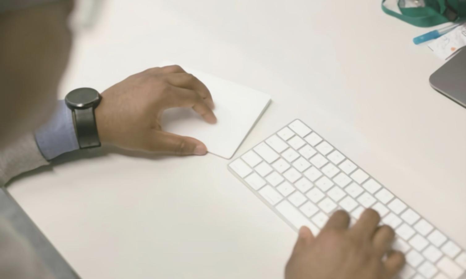 Person reviewing financial documents and receipts on desk with calculator